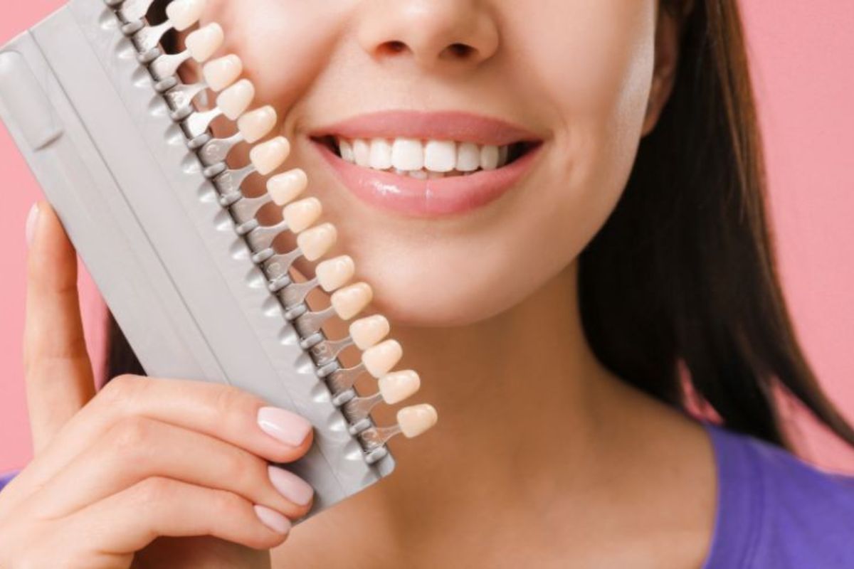 Professional woman showing natural-looking porcelain veneers